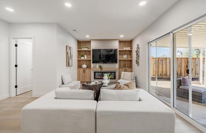 South Park Victoria Drive living room after the EPRE renovation, with built-in shelving and new flooring